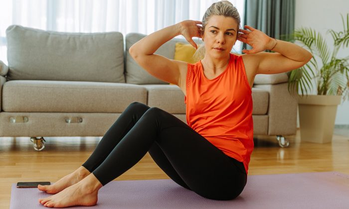 woman-exercising-on-yoga-mat